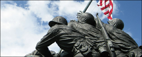Close up of World War 2 statue of five soldiers raising the American flag at Iwo Jima.