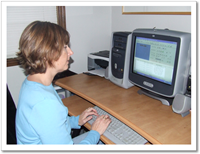 a picture of Michelle Rich captioning at her computer