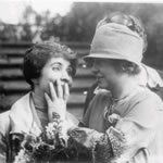 helen keller reads the lips of grace coolidge by placing an open hand across mrs. coolidges mouth
