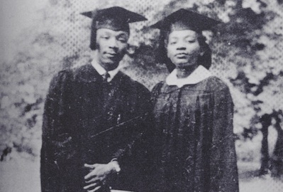 Martin Luther King Jr and his sister in cap and gown for college graduation.
